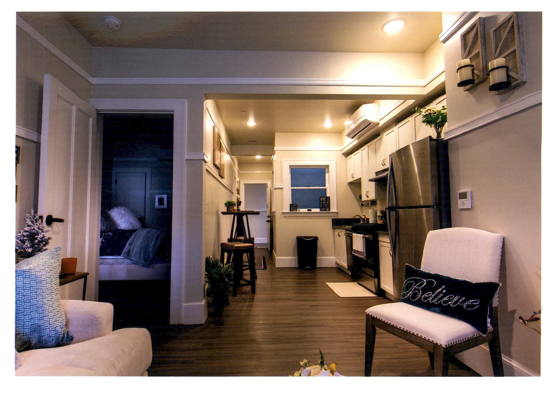 After: view of a new affordable apartment looking towards the hall entrance.